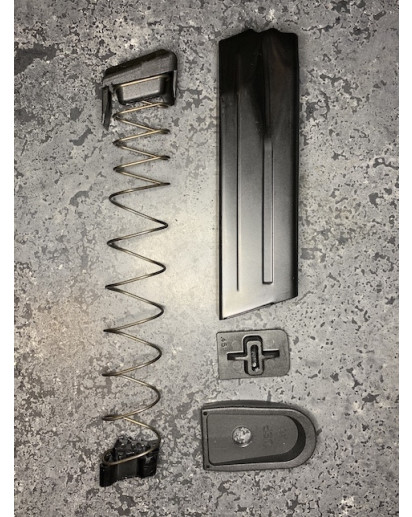 The H&K Mk23 .45acp Magazine with the Magazine Limiter installed in the spring. 