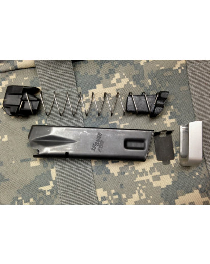 Sig P226 X-Five 10 Round Limiter for 18 Round Magazines. Installs easily in the spring as shown. Only includes the limiter. Other magazine parts not included. Please Note: Limiter marked "B92 10/17". 