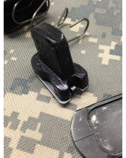 The 10 round limiter for the Sig P228 sits on top of the locking plate. Do not attach the locking plate to the spring. It should be installed as shown in this photo.