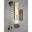 The original locking plate is used, but left unattached to the bottom of the spring. 