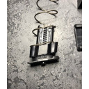 The locking plate sites under the limiter as shown. 