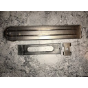 Install into magazine with locking plate positioned as shown. 