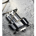 Easily installs at the base of the spring and sits on top of the locking plate as shown. 